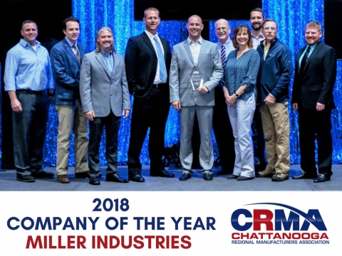 Image shows Miller Industries management team accepting the aware for the Company of the Year in 2018.  Featured in this image is Joseph Keene Marketing Manager along side Kipp Felice and CEO Will Miller.