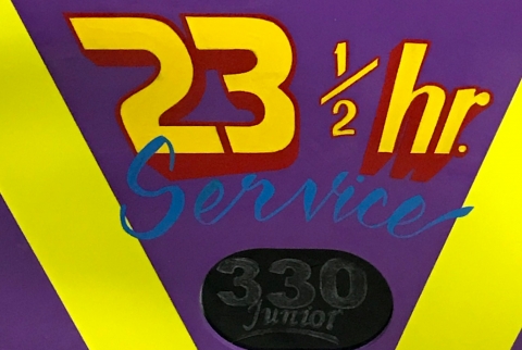 Door panel of Holmes 330 junior showing 23 and one half hour service