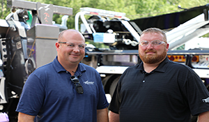 Billy Drane and Mike Fraser of Miller Industries standing in front of a rotator.