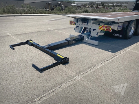 Fully extended heavy-duty industrial carrier underflit with steel drop-in style L-arms for towing box trucks.