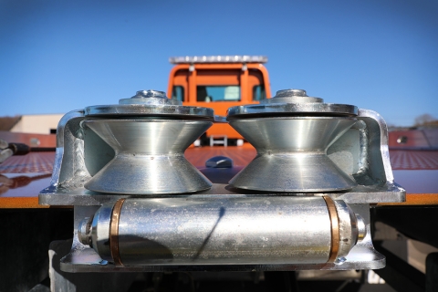 Images of the wire rope rollers that allow side pull recoveries using a car carrier