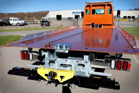 Rear view of a Century 12-Series car carrier with an approach plate roller guide attachment installed.