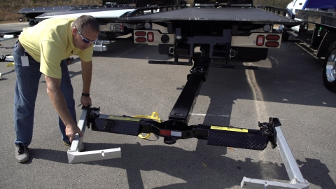 Image showing the light-weight aluminum l-arms in an car carrier wheel lift