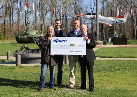 Miller Industries presents a check for over ten thousand dollars to the DAV, to help disabled veterans.  In this photos is Joseph Keene as the Marketing Manager for Miller Industries and a disabled veteran.