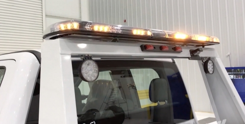 Image of a ECCO branded light bar on a Miller Industries light-duty wrecker.