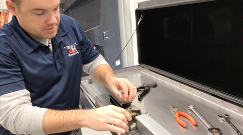 Image showing how to adjust the latch on car carrier tool boxes from Miller Industries