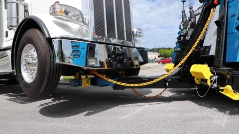 Century 7035 with towing fork towing a road tractor by the front axle.