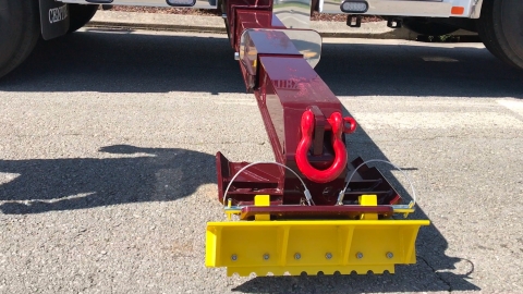 Image of the Miller Industries spade holder attached to the outriggers.