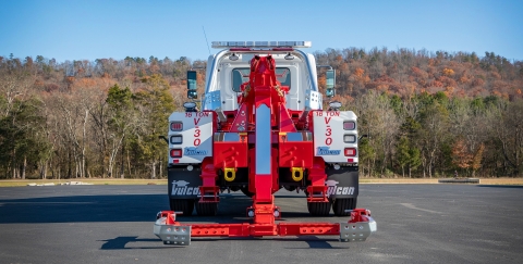 A Vulcan v-30 medium-duty integrated wrecker in the towing position with the aluminum scoops installed.