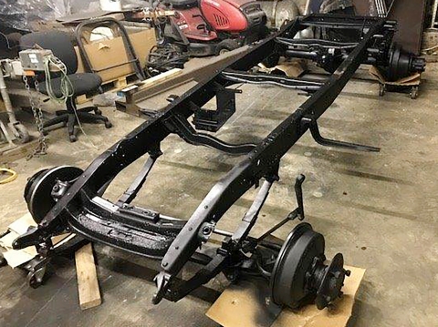 Image shows newly painted old truck chassis frame to be used in the restoration of a Holmes 330 Junior wrecker.