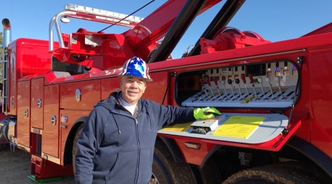 Image of Tom Luciano from Miller Industries at the controls of a century 1135 rotator