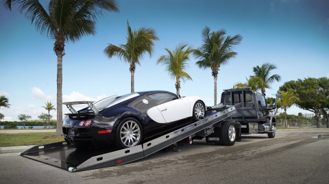 The Century 12-series rollback with the right approach option is being used to tow a low-profile Bugatti hypercar.